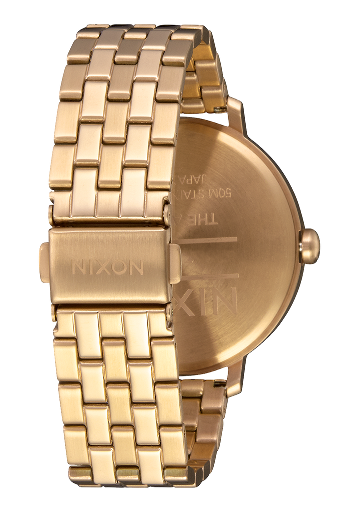 Nixon arrow 2025 rose gold